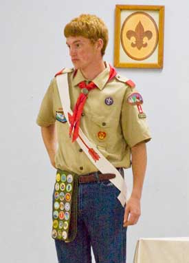 Ryan Williams and Evan Cochrane are awarded Eagle Scout rankings in a ceremony on June 10. At left, Willaims gives his mother, Alice Williams, a pin for her support. (Photo by Tyler Papazian)